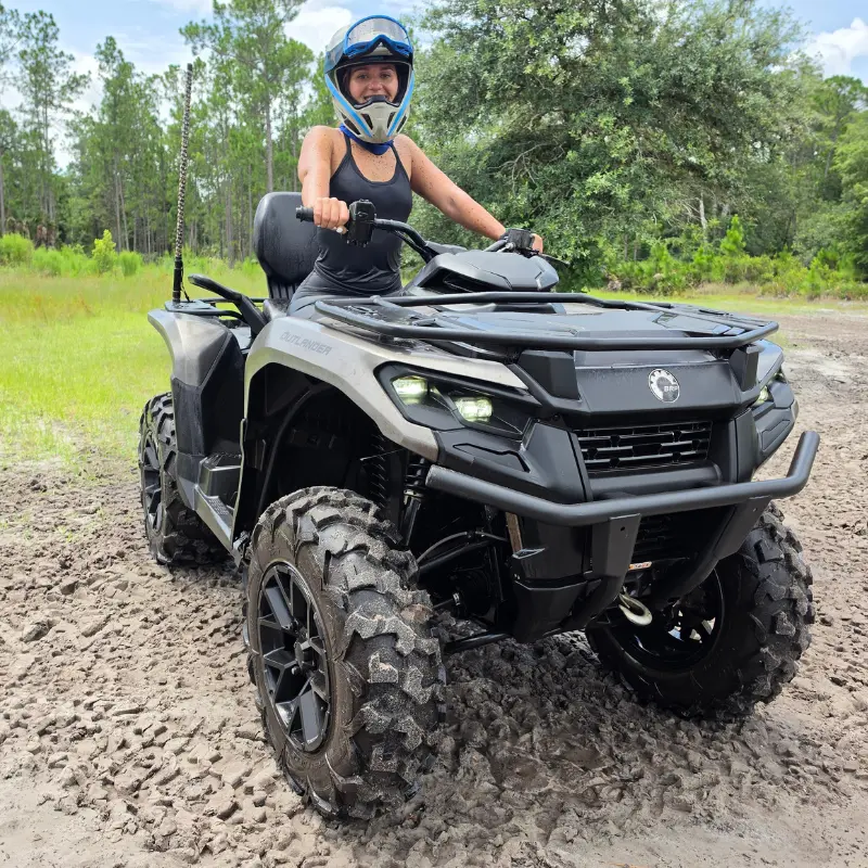 Kaleigh riding a UTV on a Central Florida trail