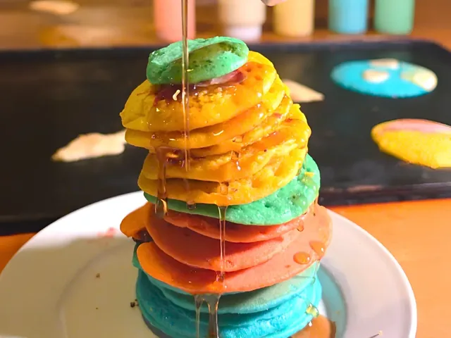 Fresh pancakes cooking on a tableside griddle