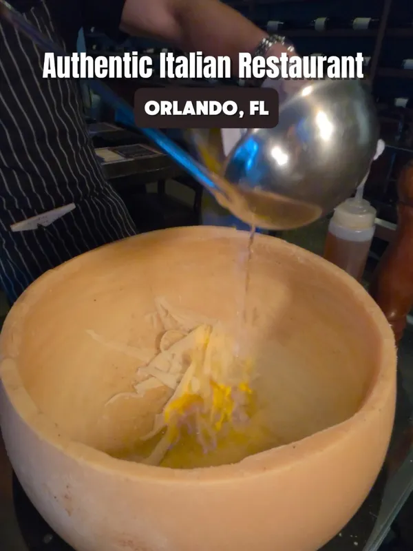 Instagram reel of the flaming cheese wheel pasta at Tartini in Orlando